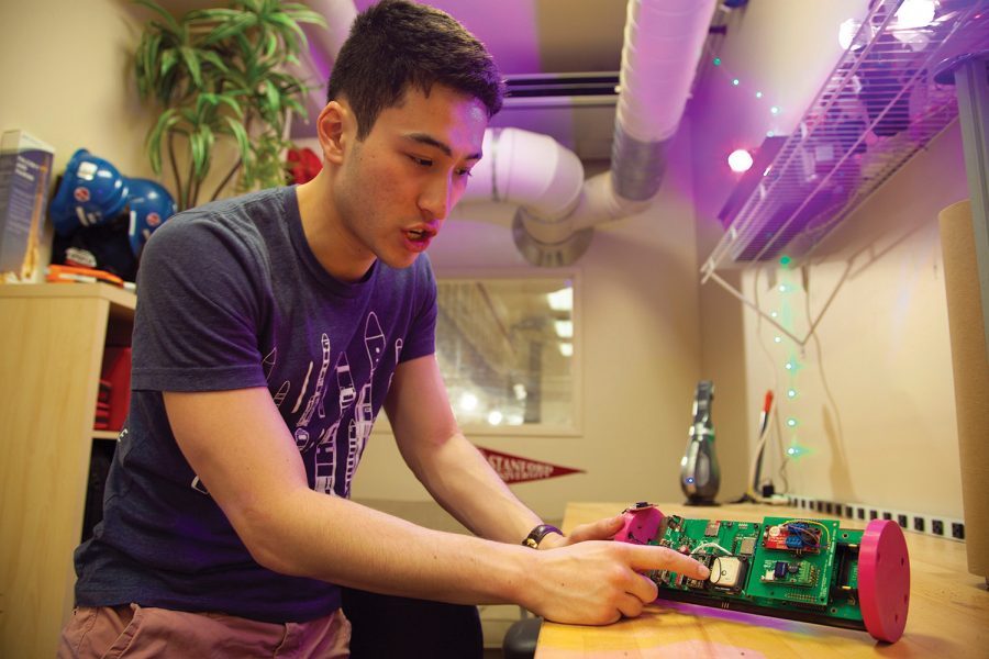 Jonathan Zwiebel, Palo Alto High School class of 2017, shows off a rocket avionics system inside a facility once home to Stanford's particle accelerator. The Stanford Student
Space Institute, abbreviated SSI, cleverly named their base of operations the ISS, both a reverse of their organization's acronym and the acronym for the International Space Station. 