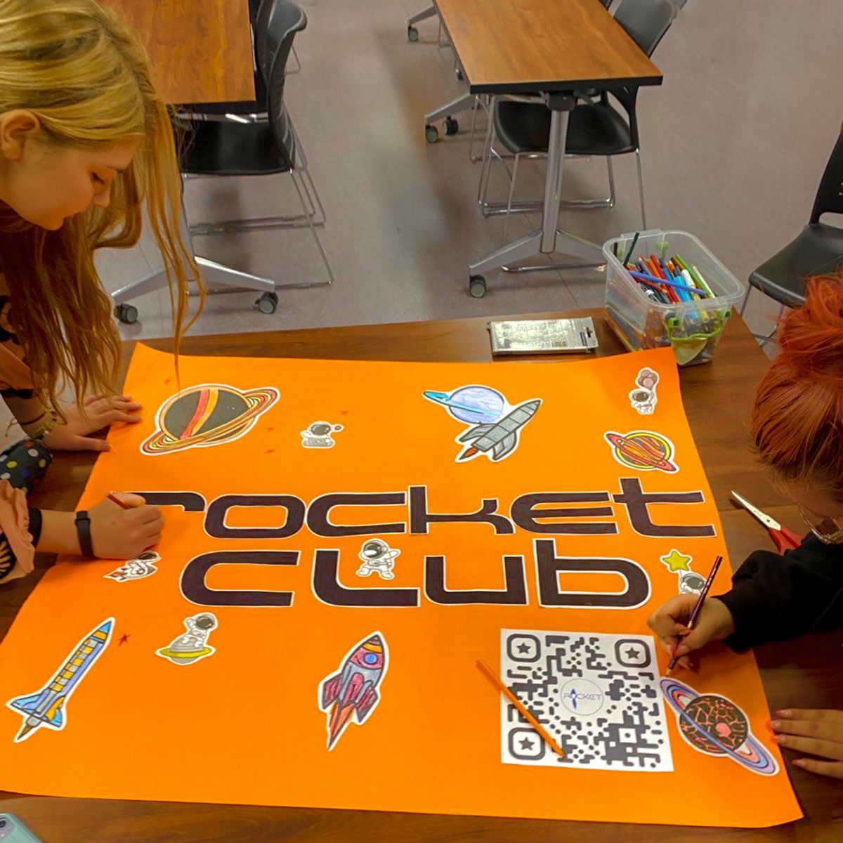 Rocket club attendees design their posters for Club Day. This is just a place where they [rocket club attendees] can find people who are like them in the mind, rocket club president Sonya Vishnyakova said.