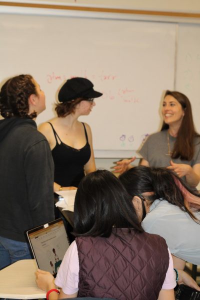 Science teacher Alicia Szebert talks to her class just before the final exam about not giving up in chemistry. “I like chemistry because it tends to be a more challenging course,” Szebert said. “So watching students work to understand and the growth that comes with that is very rewarding as a teacher.”
