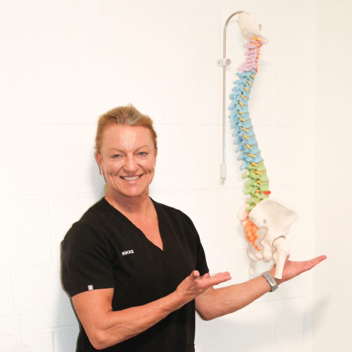 Chiropractor Rikke Johansen gestures towards a model of a healthy spine. Spine problems are becoming even more prevalent in teenagers because of increased screen time. “Ive been in practice for 35 years and I’ve seen what posture has done to people long before we had technology and hand-held devices.”
