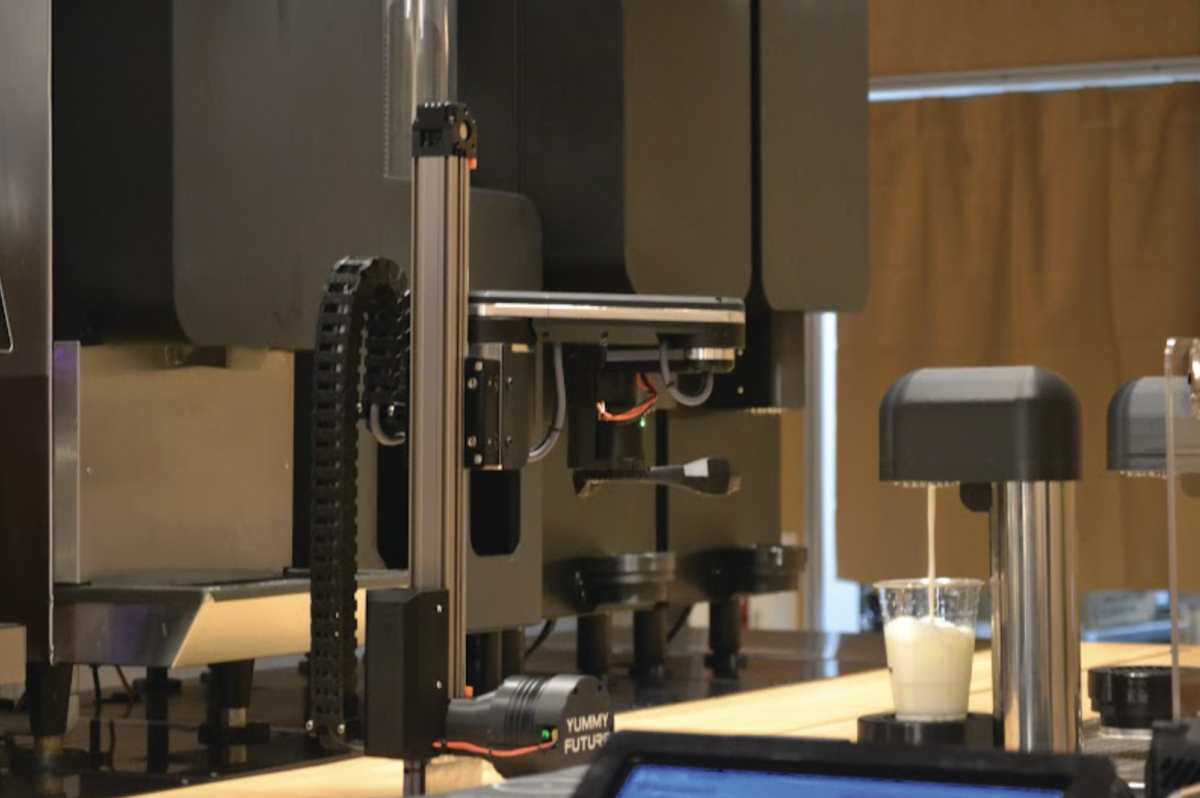 MEASUREMENT MONITORING — Yummy Future’s robotic arm waits patiently for milk to fill the cup before transferring the drink to the next station. The robot uses cameras and sensors to verify the drink’s cup, ice, color and fill level with automatic retry if needed. The system is engineered and tested to bring an accuracy rate of 99.7% for all recipes.